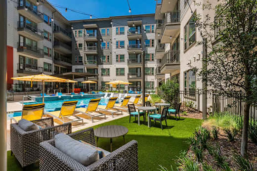 Inwood Station courtyard lounge, from the listing